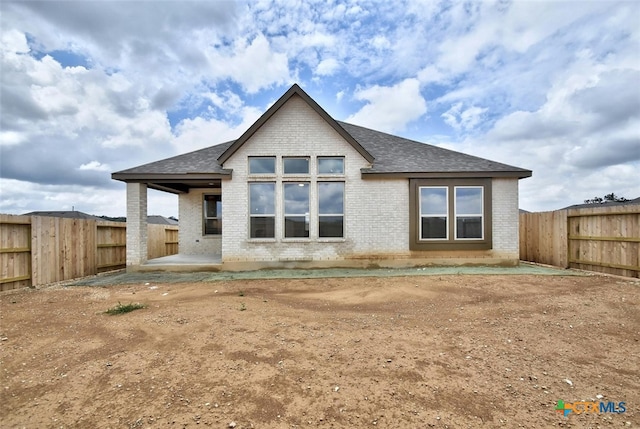 back of house with a patio area