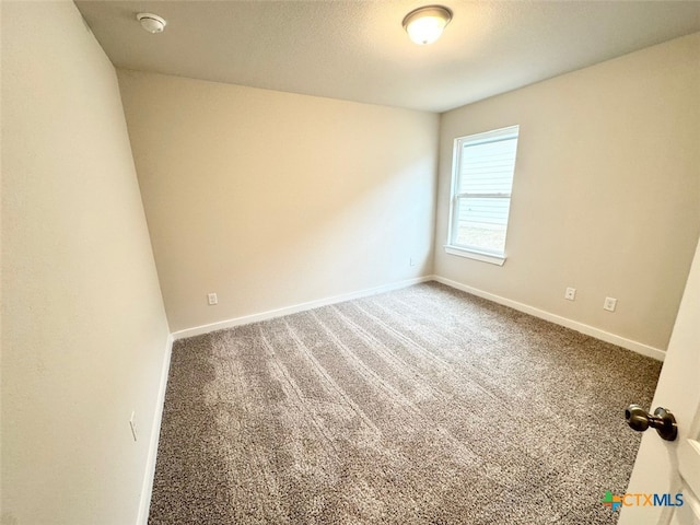 unfurnished room featuring carpet flooring