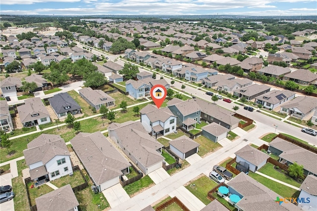 aerial view of property's location featuring nearby suburban area