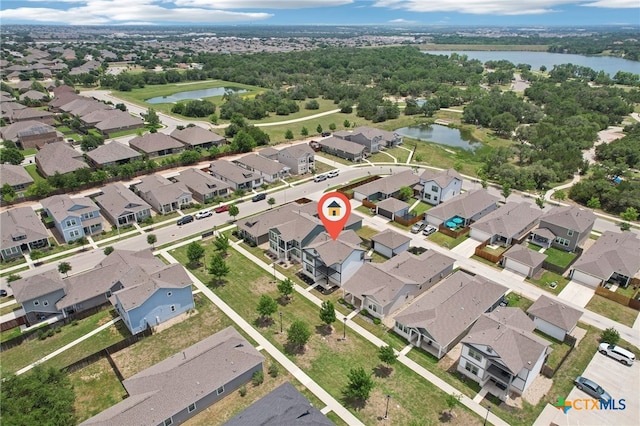 aerial overview of property's location featuring a large body of water and nearby suburban area