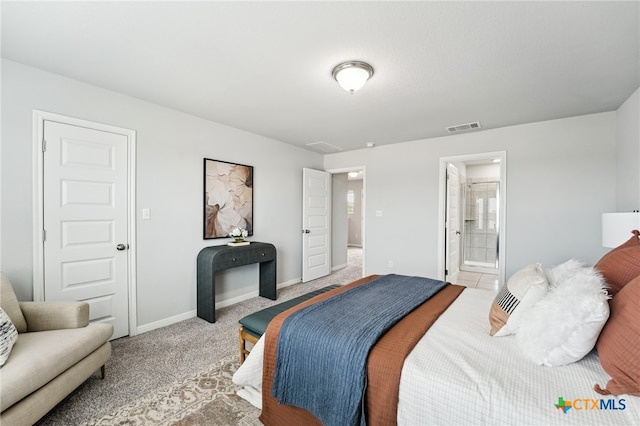 bedroom with light colored carpet, baseboards, and connected bathroom