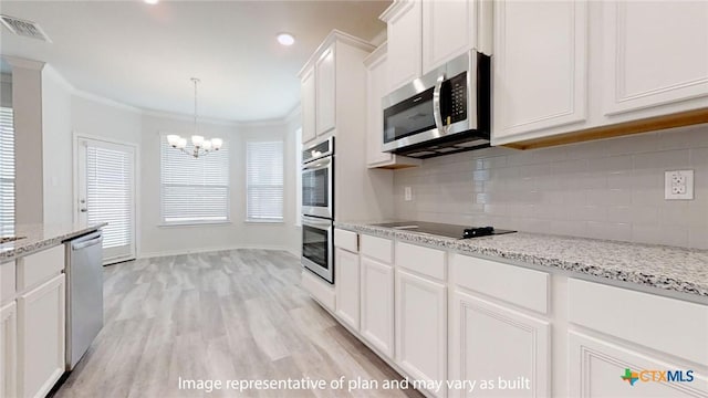 5105 Othello Dr, Belton, TX 76513 - kitchen with stainless steel appliances, a chandelier, white cabinetry, decorative backsplash, and light wood-style floors