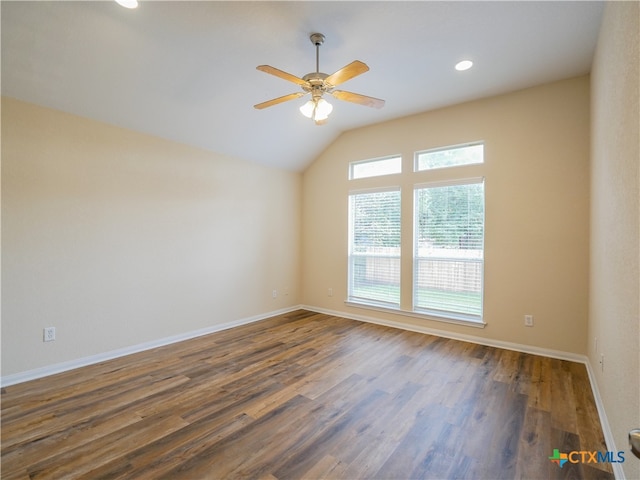 unfurnished room with ceiling fan, lofted ceiling, and dark wood-type flooring