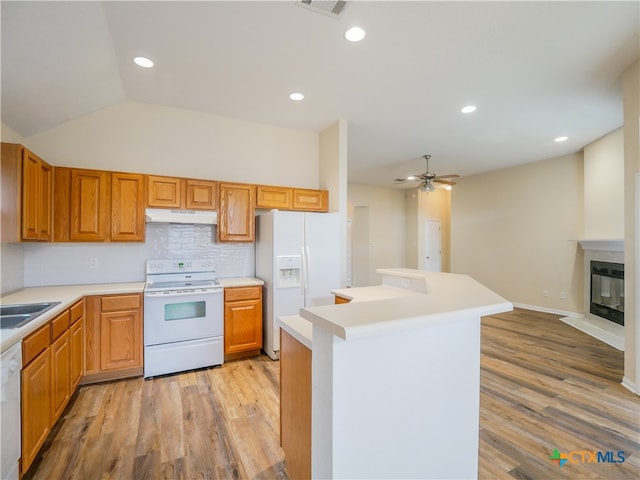 kitchen featuring vaulted ceiling, ceiling fan, light hardwood / wood-style floors, and white appliances