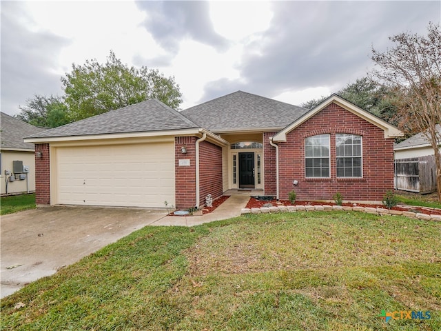 single story home featuring a front yard and a garage