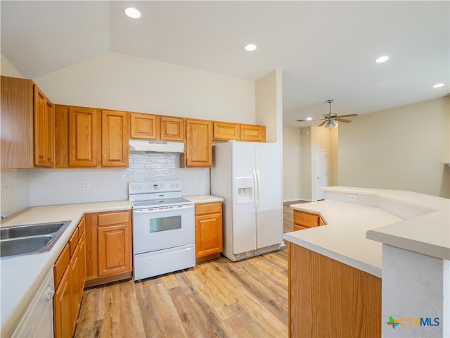 kitchen with lofted ceiling, white appliances, sink, light hardwood / wood-style flooring, and ceiling fan