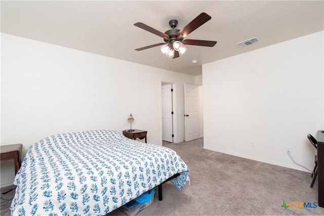 bedroom with light carpet, baseboards, visible vents, and a ceiling fan