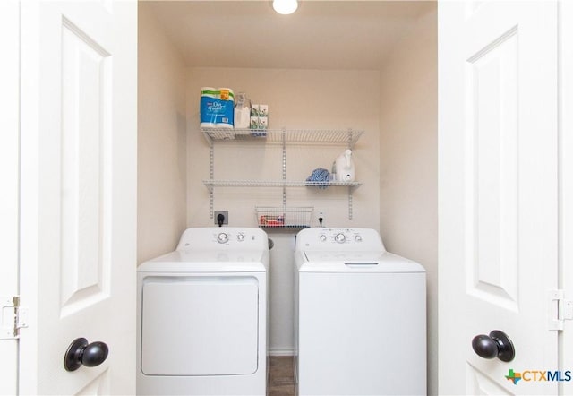 laundry area with separate washer and dryer