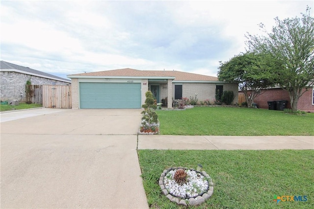 single story home featuring a garage and a front lawn