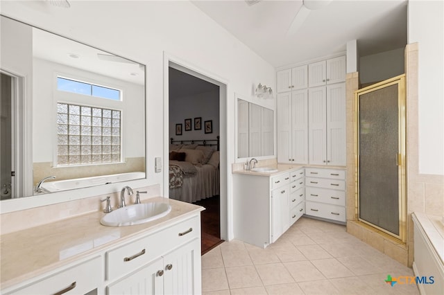 1600 Cattlemens Row, Lockhart, TX 78644 - full bathroom featuring vanity, a bath, and a stall shower