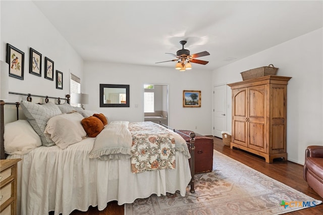 1600 Cattlemens Row, Lockhart, TX 78644 - bedroom featuring dark wood-style flooring and ceiling fan