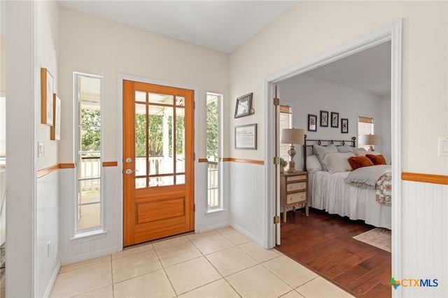1600 Cattlemens Row, Lockhart, TX 78644 - foyer featuring light tile patterned floors, baseboards, and wainscoting