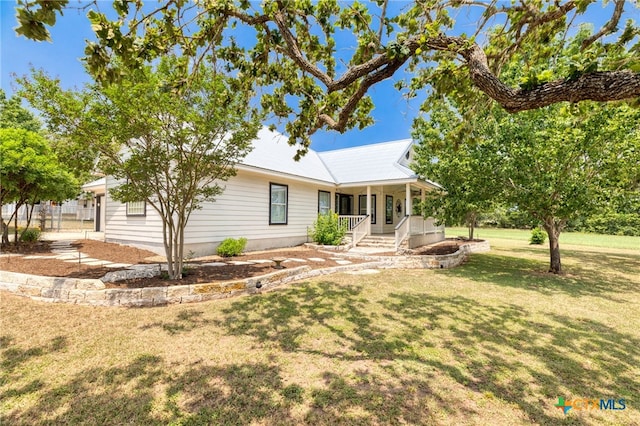 1600 Cattlemens Row, Lockhart, TX 78644 - view of front of property featuring covered porch and a front lawn