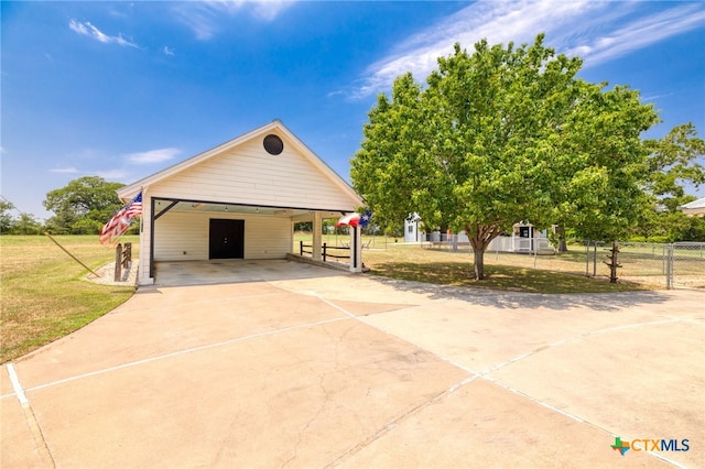 1600 Cattlemens Row, Lockhart, TX 78644 - garage with driveway and a carport