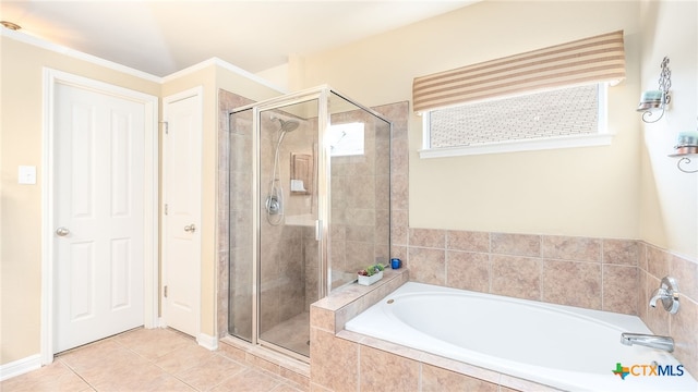 bathroom featuring plus walk in shower and tile patterned floors