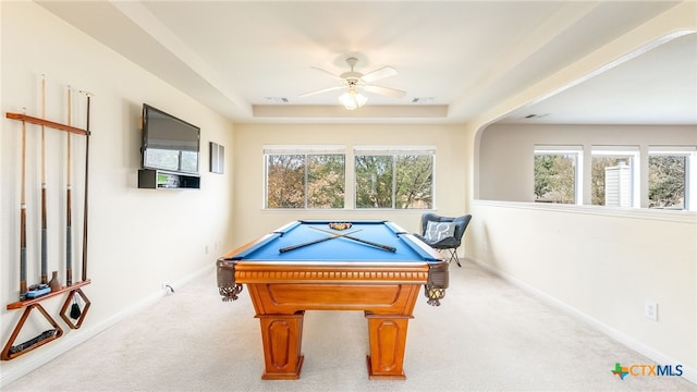 recreation room with a tray ceiling, ceiling fan, light colored carpet, and pool table