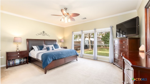 bedroom featuring ceiling fan, light colored carpet, and crown molding