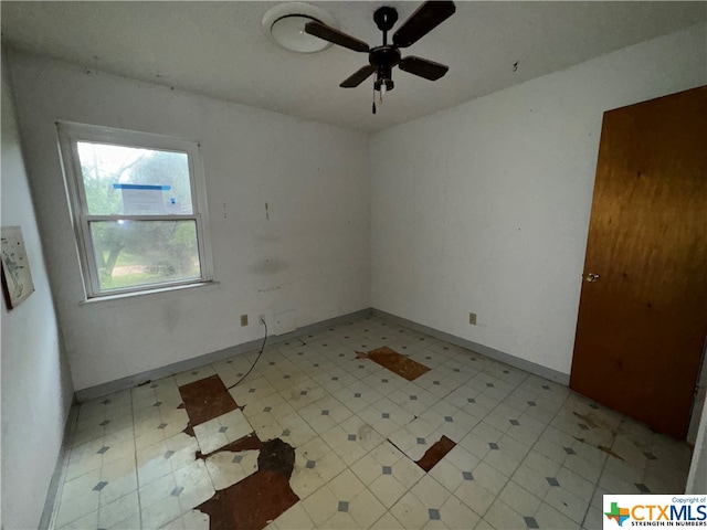 spare room with ceiling fan