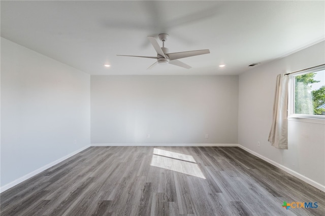 501 College Ave, Florence, TX 76527 - unfurnished room with wood finished floors, a ceiling fan, and recessed lighting