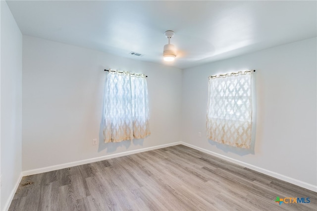 501 College Ave, Florence, TX 76527 - unfurnished room featuring wood finished floors and baseboards
