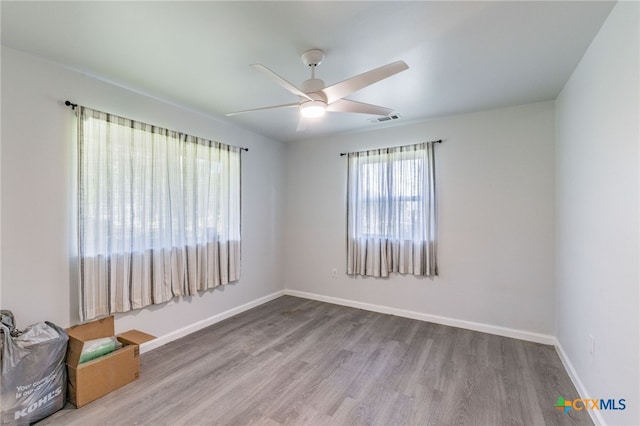 501 College Ave, Florence, TX 76527 - unfurnished room with wood finished floors and ceiling fan