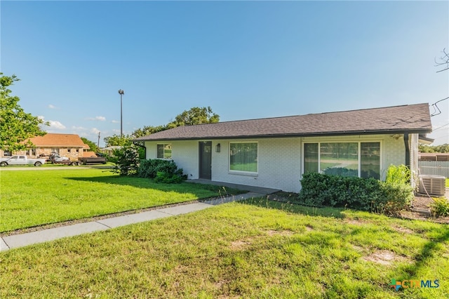 501 College Ave, Florence, TX 76527 - ranch-style home with a front lawn and brick siding