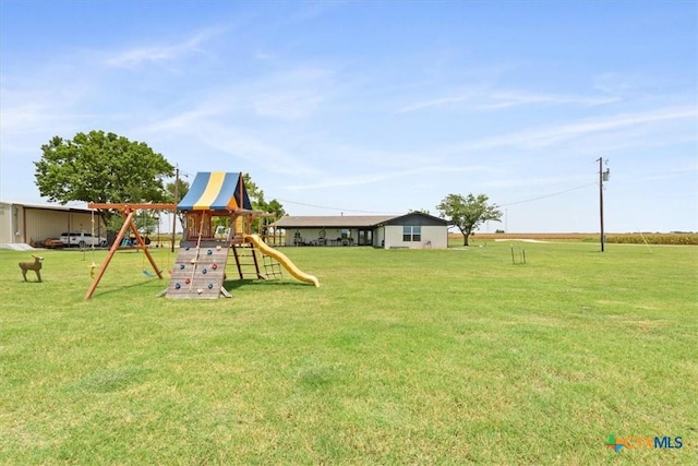 17179 Cyclone Rd, Burlington, TX 76519 - view of green lawn with a playground