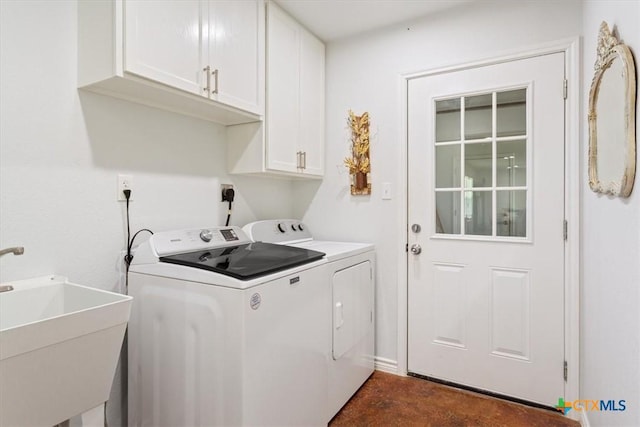 17179 Cyclone Rd, Burlington, TX 76519 - laundry area featuring cabinet space and separate washer and dryer