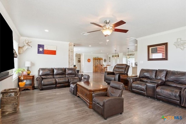17179 Cyclone Rd, Burlington, TX 76519 - living room featuring ceiling fan, wood finished floors, ornamental molding, and recessed lighting