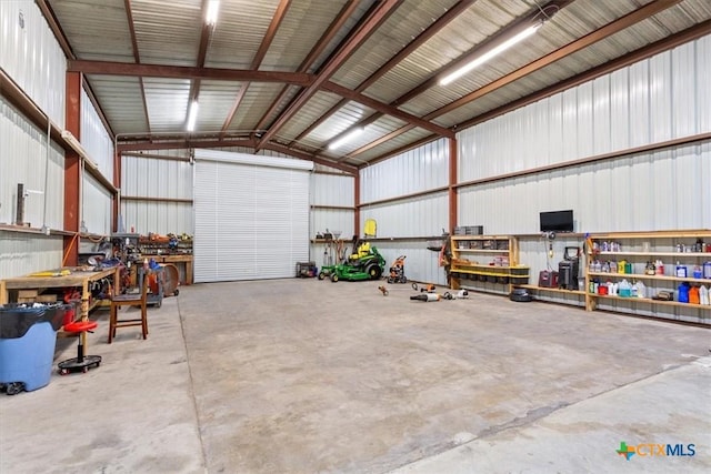 17179 Cyclone Rd, Burlington, TX 76519 - garage with a workshop area and metal wall