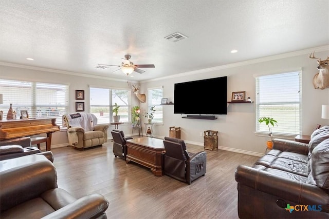17179 Cyclone Rd, Burlington, TX 76519 - living room featuring ornamental molding, wood finished floors, ceiling fan, and recessed lighting