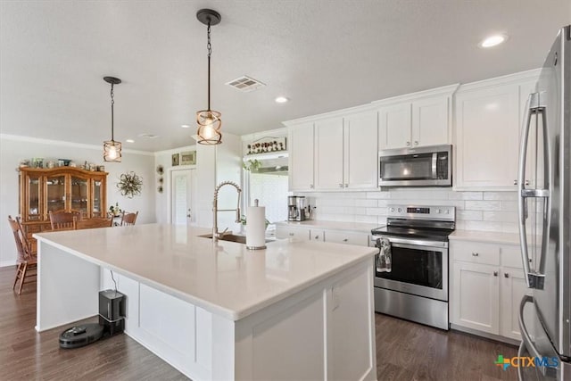 17179 Cyclone Rd, Burlington, TX 76519 - kitchen featuring appliances with stainless steel finishes, white cabinetry, backsplash, light countertops, and recessed lighting