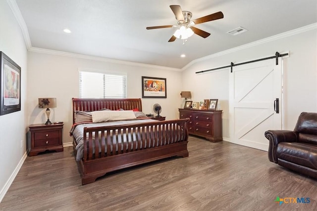 17179 Cyclone Rd, Burlington, TX 76519 - bedroom featuring a barn door, wood finished floors, crown molding, recessed lighting, and ceiling fan
