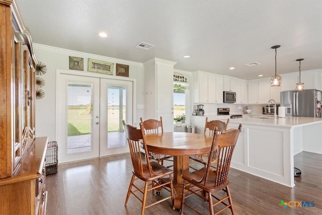 17179 Cyclone Rd, Burlington, TX 76519 - dining room with dark wood-type flooring, french doors, recessed lighting, and crown molding