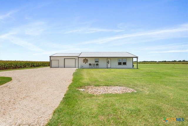 17179 Cyclone Rd, Burlington, TX 76519 - view of front of property featuring a garage, driveway, a front yard, and a rural view