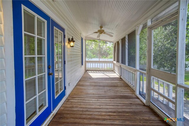 1322 N Ave F Ave, Shiner, TX 77984 - unfurnished sunroom featuring a ceiling fan, plenty of natural light, and french doors