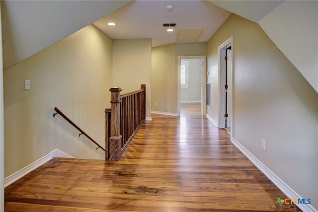 hall with hardwood / wood-style floors