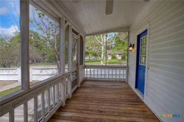 unfurnished sunroom with lofted ceiling