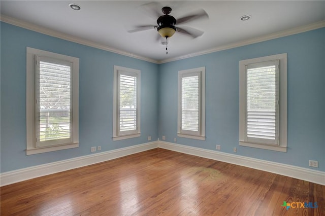 1322 N Ave F Ave, Shiner, TX 77984 - unfurnished room with baseboards, wood finished floors, a ceiling fan, and crown molding