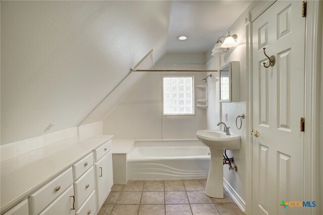 bathroom with tile patterned flooring and bathing tub / shower combination