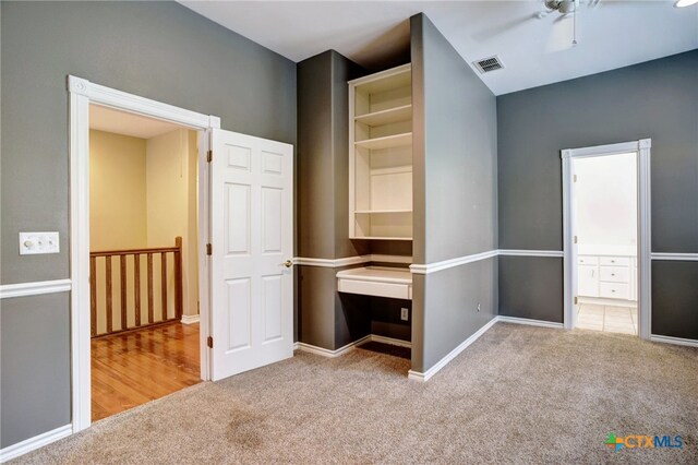 unfurnished bedroom featuring ceiling fan and carpet floors