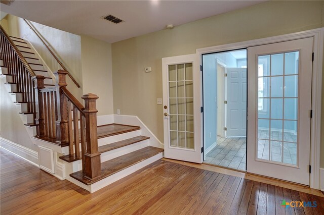 entryway with wood-type flooring