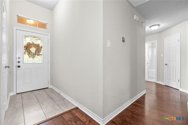 2804 Bluejay Dr, Killeen, TX 76549 - foyer entrance featuring baseboards and wood finished floors