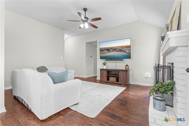 2804 Bluejay Dr, Killeen, TX 76549 - living room with a ceiling fan, dark wood-style floors, baseboards, a fireplace, and lofted ceiling