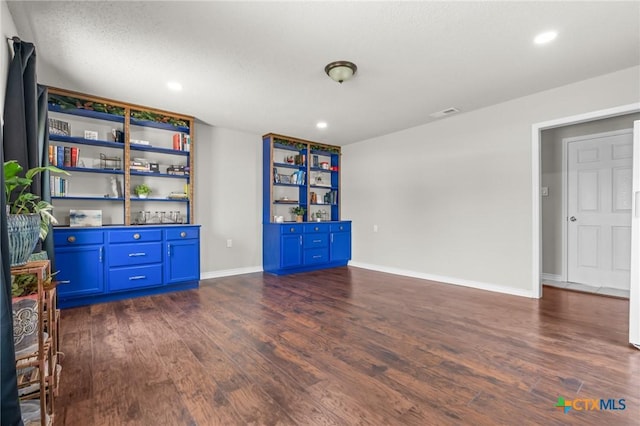 2804 Bluejay Dr, Killeen, TX 76549 - unfurnished room featuring dark wood-style flooring, baseboards, and recessed lighting