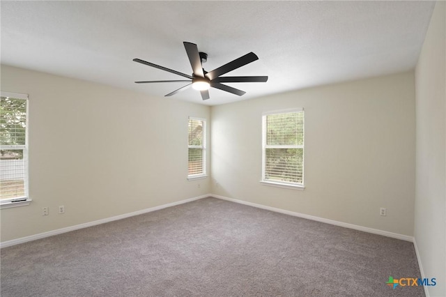 503 Pine St, Smithville, TX 78957 - carpeted spare room featuring a ceiling fan and baseboards