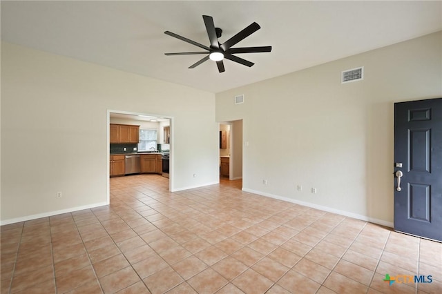 503 Pine St, Smithville, TX 78957 - unfurnished living room with a ceiling fan and light tile patterned floors