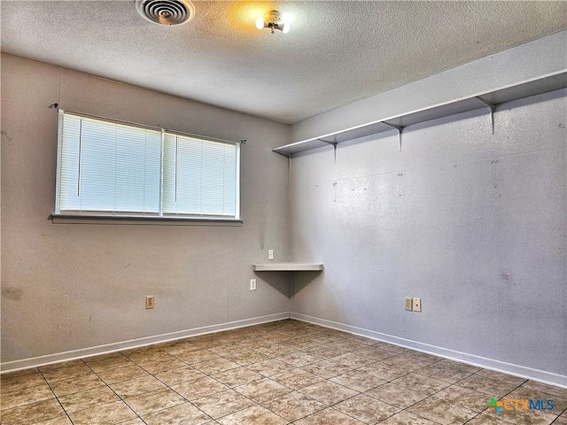 empty room with a textured ceiling