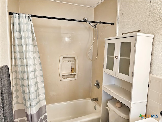 bathroom with toilet and shower / bath combo with shower curtain