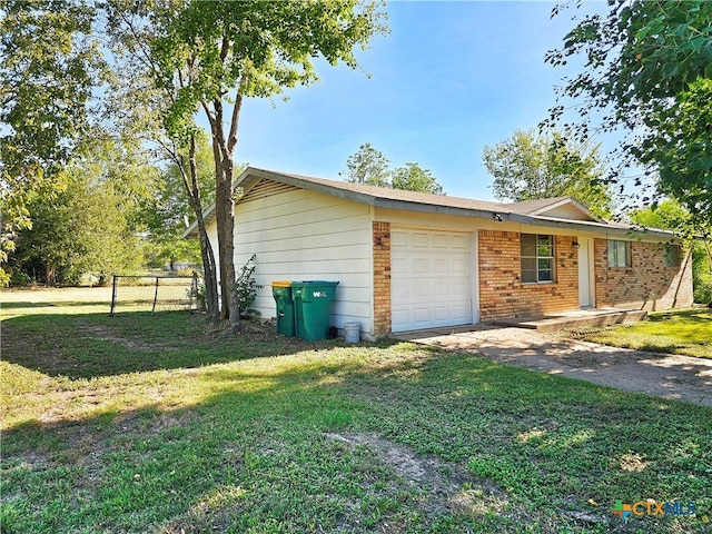 view of property exterior with a garage and a yard